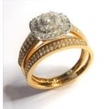 A diamond-set and 18-carat gold cluster ring; centrally-set with a brilliant-cut diamond estimated