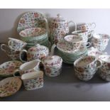 A Minton 'Haddon Hall' part tea service to include cups, saucers, teapot, coffee pot and lidded