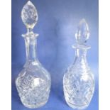 A fine mallet-shaped cut-glass decanter and stopper, together with one other slightly smaller