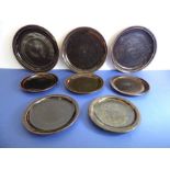 Eight Winchcombe Pottery stoneware plates with Tenmoku glaze: three 24cm dinner plates and five side