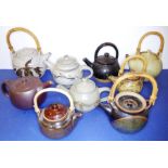A collection of nine studio stoneware teapots; mostly unmarked, one in the style of Winchcombe