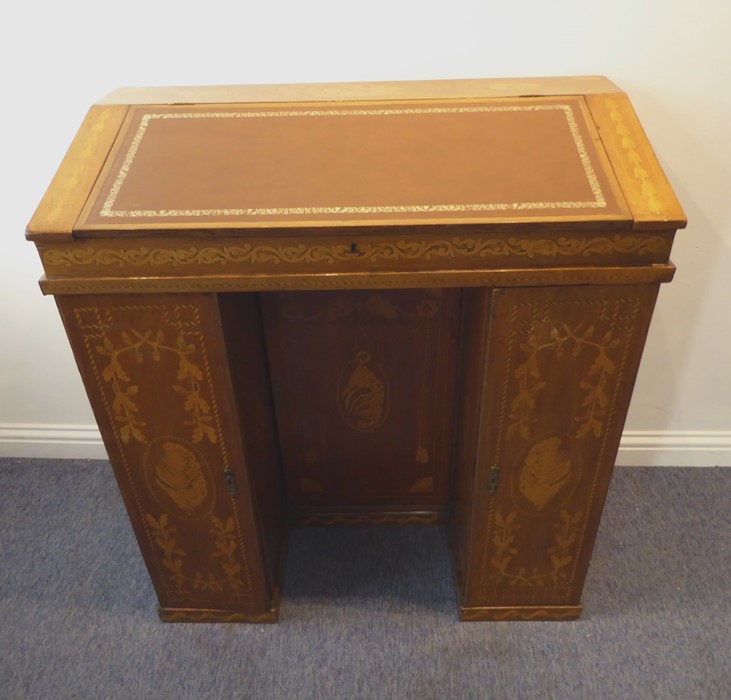 A fine 19th century walnut and marquetry maître d's desk; the sloping fall with tooled leather inset