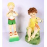 Two Royal Worcester porcelain figurines modelled by Freda Doughty: 'Friday's Child is Loving and