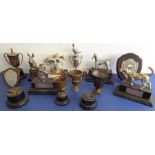 An interesting assortment of school achievement trophies; to include four animals on rectangular