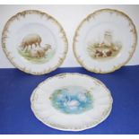 A pair of early 20th century French porcelain cabinet-style plates: each hand-decorated, one with