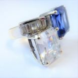 A 9-carat white gold ring set with very large diamond-style and sapphire-style stones (a handmade