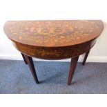 A late 19th / early 20th century demi-lune walnut and boxwood marquetry side table; raised on square