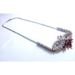 A ruby, diamond and 18-carat white-gold necklace, the front scrolling section set with 40