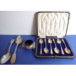 A cased set of six hallmarked silver teaspoons; together with a pair of fiddle-pattern