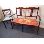 An early 20th century two-seater stained-wood sofa with twin splats pierced with Art Nouveau-style