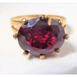 A garnet and 9-carat gold ring, size P (gross weight 3.8g) (The cost of UK postage via Royal Mail
