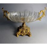 A late 19th century boat-shaped French glass and gilded comport; the two-handles as open mouthed