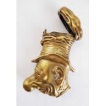 An unusual Victorian-style brass vesta case modelled as the bust of the comic-strip character,