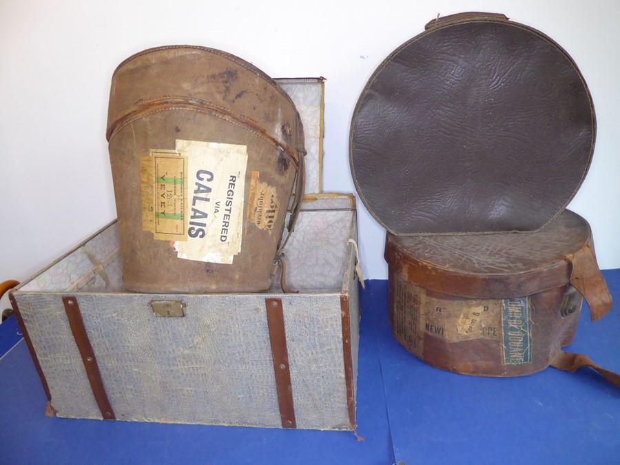 Three hat boxes and a small two-handled wooden-sided travel trunk; original shipping labels pasted