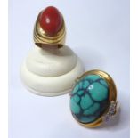 Two mid-20th century dress rings: the first with an oval turquoise matrix cabochon collet set to the