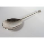 A  silver Guild of Handicrafts Arts and Crafts style spoon with garnet-coloured cabochon finial,