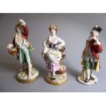 Three Spanish porcelain figures: a barefooted male with a basket of fruits and a female with a