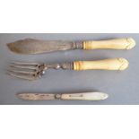 A late 19th century silver-plate-bladed and ivory-handled fish slice and fork; each with ornate