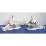 A pair of circa 1870/80 Dresden porcelain sweetmeat figural baskets; reposing lady and gentleman