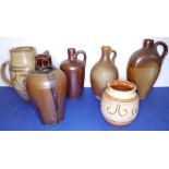 A group of six to include three stoneware handled flasks (the tallest 24cm), a 12.5cm vase marked '