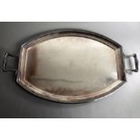 A large early 20th century barrel-shaped two-handled silver-plated serving tray; monogrammed and