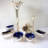 Five hallmarked silver cruets with blue-glass liners and spoons, together with a pair of weighted
