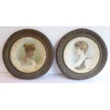 A pair of circular brass-framed studies of Victorian/Edwardian-style ladies (45cm diameter)