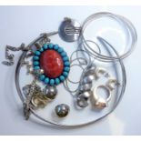 A small collection of jewellery; to include a torc necklace, a three-hoop bangle by KSB (silver