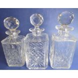 Three very fine hand-cut spirit decanters; of square form and with canted shoulders (approx. 23cm,