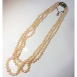 A three-row cultured pearl necklace; graduated cultured pearls (measuring 7.2mm - 3.2mm in diameter)