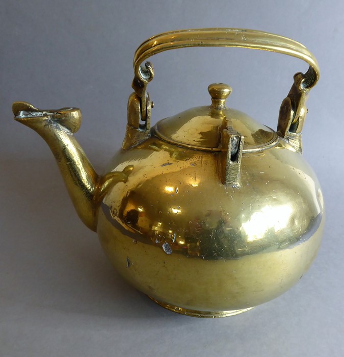An unusual and heavy late 19th/early 20th century brass kettle of spherical shape (possibly