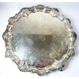A 19th century heavy hallmarked silver salver: raised shell-style cast border, foliate engraving and