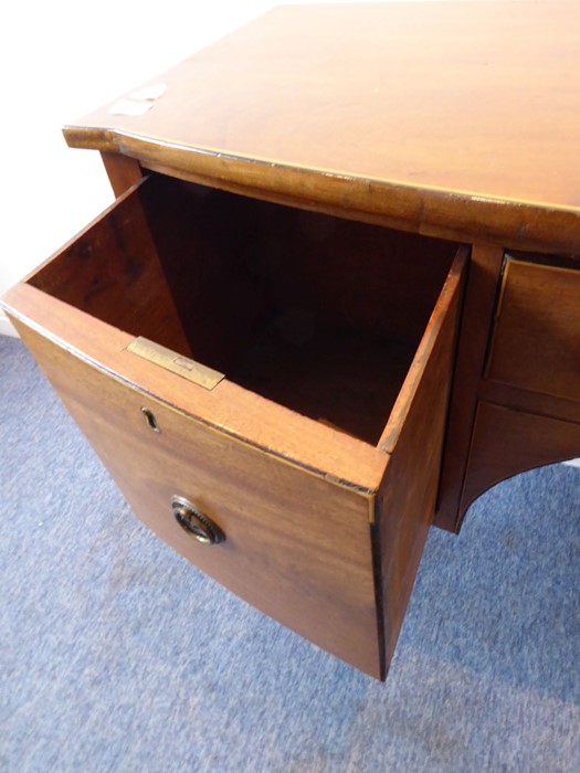 An early 19th century bow-fronted mahogany sideboard of small proportions; the central drawer - Image 5 of 6