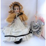 An early 20th century bisque-head doll by Armand Marseille (Germany); in good overall condition