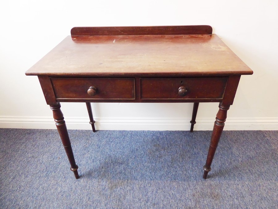 A mid-19th century mahogany side/writing table; the overhanging top with galleried back above two - Image 2 of 5