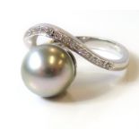 A cultured pearl, diamond-set and 18-carat white-gold ring, the silvery grey cultured pearl