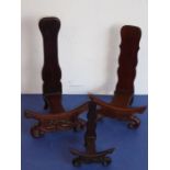 Three varying sized carved Chinese rosewood plate stands (the tallest 25.75cm)