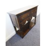 A good reproduction oak dresser base in 18th century style (modern); the slightly overhanging top