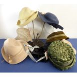An assortment of various ladies hats together with other associated items including bowties etc.,