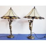 A pair of cast bronze-style figural table lamps modelled as female nudes; Tiffany-style flower-