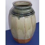 Richard BATTERHAM (b. 1936); a large Studio-ware style stoneware jar of faceted barrel form, green