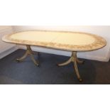 A shabby-chic-style extending oval dining table; the reeded-edge top decorated in paint with