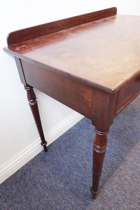 A mid-19th century mahogany side/writing table; the overhanging top with galleried back above two - Image 4 of 5