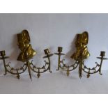 Two late 19th/early 20th century three-light brass wall appliques; each headed with shoulder