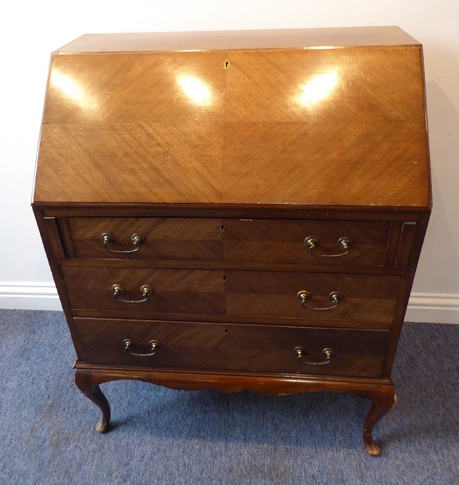 An early 20th century walnut writing bureau; the quarter-veneered sloping fall opening to reveal - Image 2 of 7