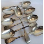 Eight early 19th century and later hallmarked silver fiddle pattern serving spoons; various maker'