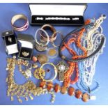 Various costume jewellery including two boxed silver rings, various necklaces including coral and