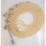 Four rows of freshwater cultured pearls locating onto a white-metal (marked 925) spacer, three of