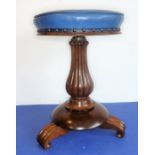 An early Victorian circular adjustable piano/music stool; reeded baluster-turned column and on three