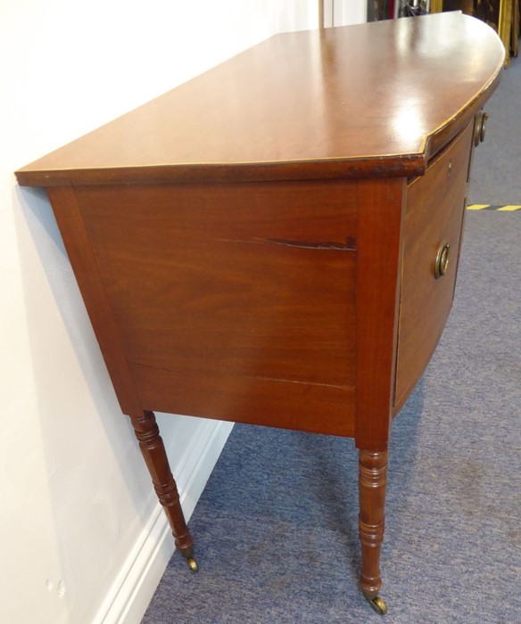 An early 19th century bow-fronted mahogany sideboard of small proportions; the central drawer - Image 4 of 6